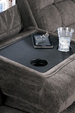 A Drop-Down Table-Top in the Sofa's Center Cushion Provides a Holder for Magazines, Beverages and Snacks
